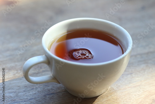 Hot coffee on a wooden table.