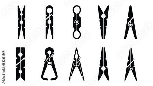 A collection of various black clothes pegs on a white background