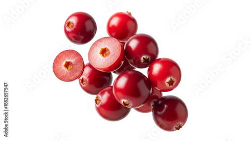 Fresh vibrant ruby-red cranberries, whole and halved, scattered on pristine white, highlighting natural appeal