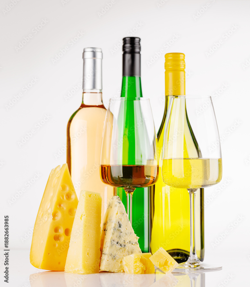 Obraz premium Assorted cheeses and wine on white background