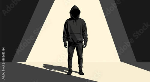 A person in a hooded sweatshirt stands in a dark room with a spotlight shining on them from above casting a shadow on the floor conveying a sense of mystery