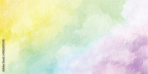 Soft pastel watercolor wash background with blended yellow green blue and purple hues creating a gentle gradient effect creative projects and