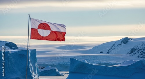 Greenlandic flag waving against a dramatic Arctic sky, symbol of sovereignty