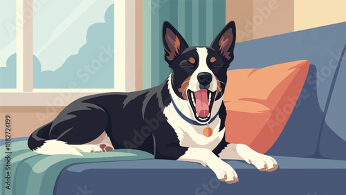 A happy dog yawns widely while lounging on a blue sofa with a large orange pillow