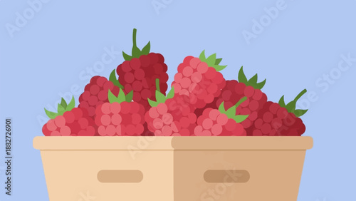 A basket overflowing with ripe red raspberries on a pale blue background