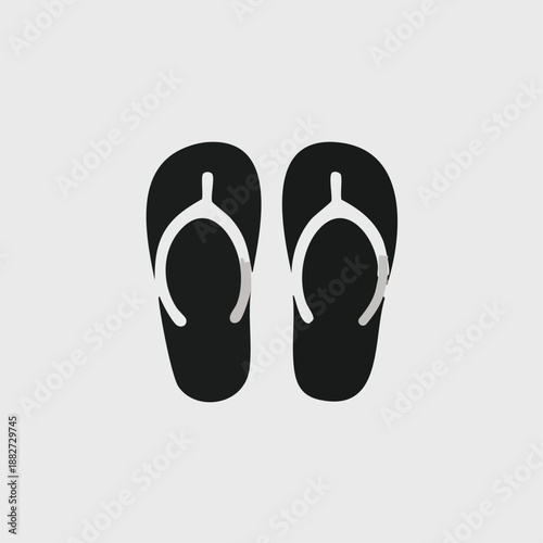 Black and white flip flops on white background
