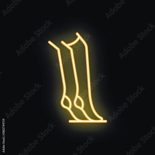 Glowing yellow neon sign depicting female legs standing on tiptoe, conveying elegance and femininity