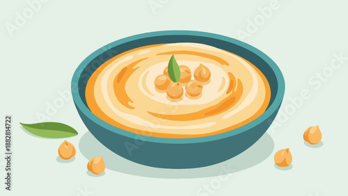 Creamy chickpea dip in a teal bowl, garnished with legumes and leaves