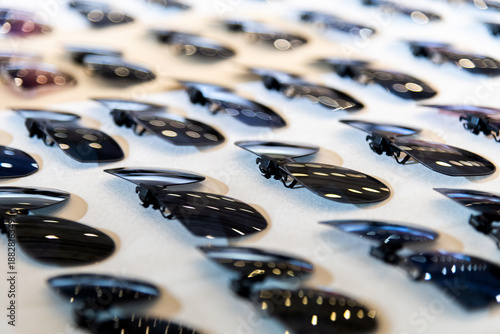 Clip sunglasses are displayed in the store