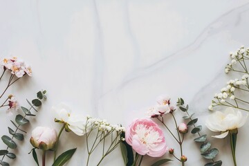 Floral flat lay border with pink peonies and eucalyptus on white marble. Elegant spring background with large top copy space for design.