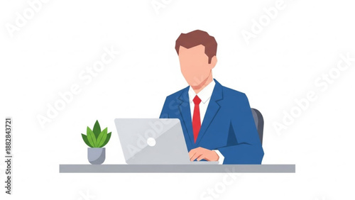 A businessman working on a laptop at a desk with a plant