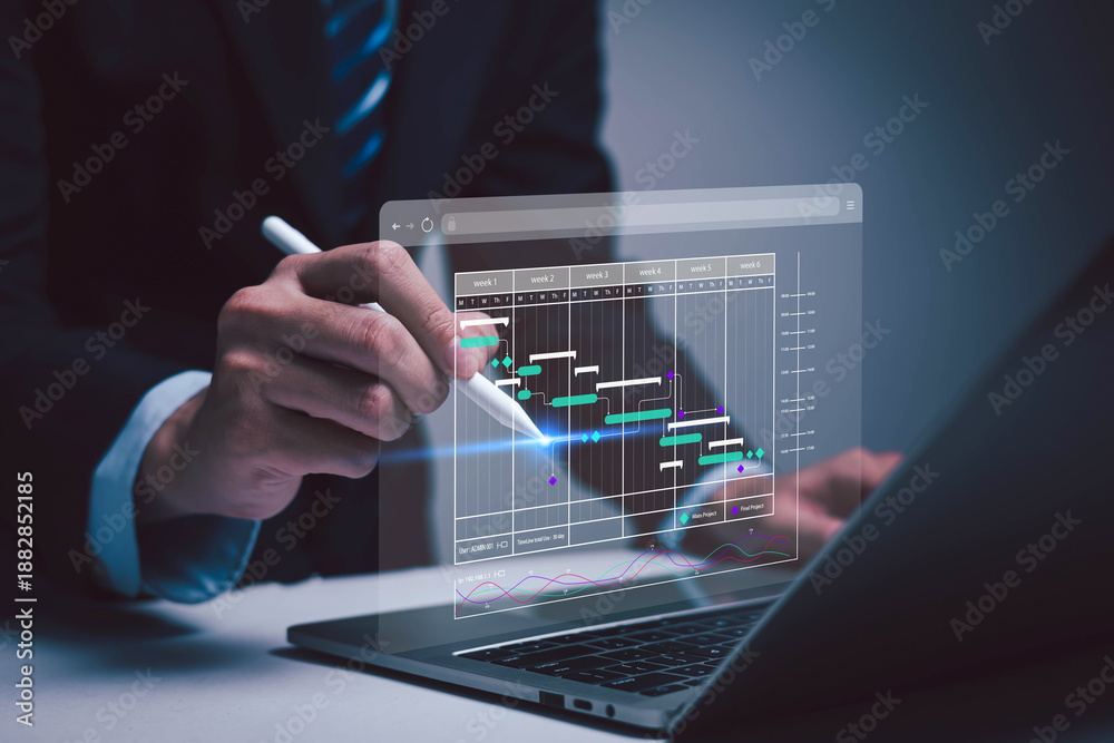 Fototapeta premium Person using laptop with digital calendar interface highlighting schedule dates. Concept of time management, business planning, productivity, deadline reminder, online scheduling, work organization. 