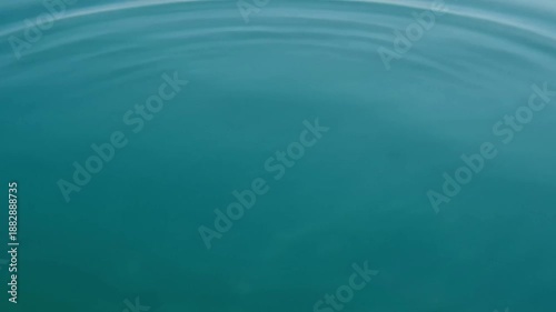 Calm turquoise water with gentle ripples on the surface.