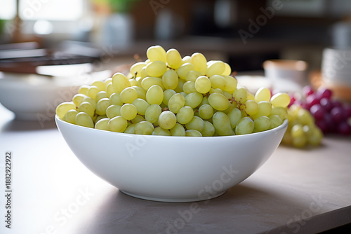 Fresh Grapes in White Ceramic Bowl on Linen-Covered Table with Soft Side Lighting