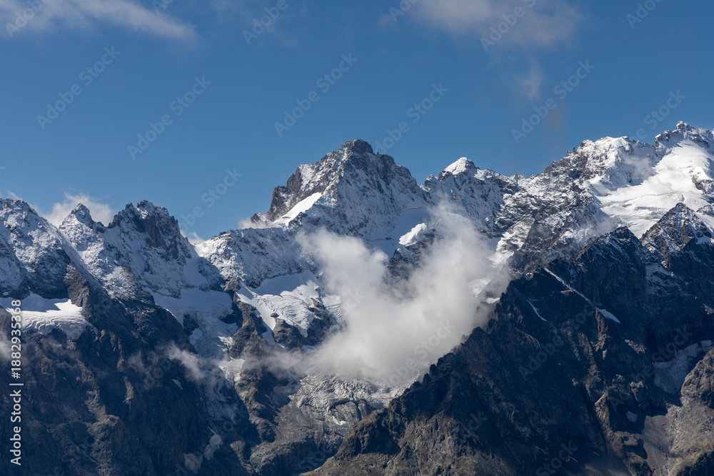 Fototapeta premium Panoramic mountain view from Col du Galibier, showcasing La Meije and surrounding alpine landscapes in the French alps