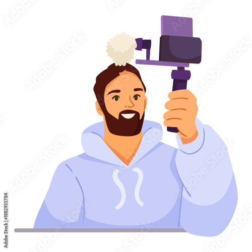 Bearded man in hoodie holding video camera with microphone, cartoon style on white background. Concept of vlogging and content creation. Vector illustration
