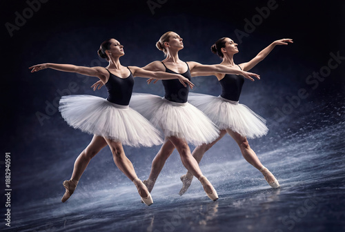 Three beautiful ballerinas dancing together on dark stage