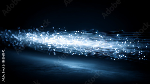 Luminous fiber optic bundle transmitting high-speed digital data across a reflective dark surface, creating an abstract stream of light and technological connectivity.