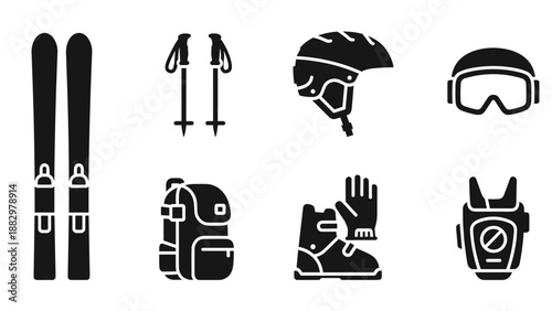 Winter sports essentials: ski gear in black silhouette