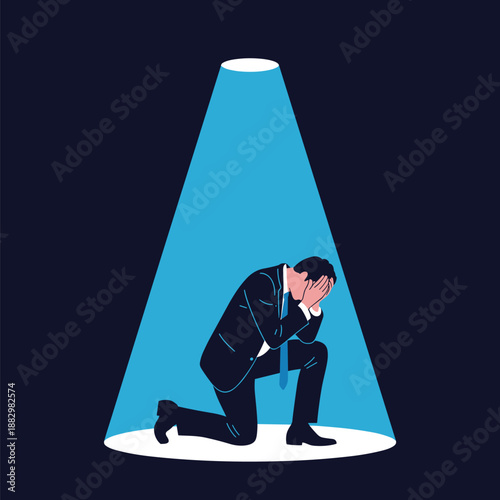 Businessman Kneeling in Spotlight Covering Face in Despair Keywords: businessman, kneeling, spotlight, despair, sadness, failure, stress, depression, crisis, problem, dark