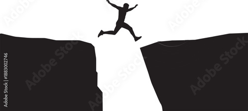 Black Silhouette of a Determined Man Jumping Across a Deep Chasm or Ravine for Business Risk Personal Growth Courage Breakthrough and Success Concept Assets