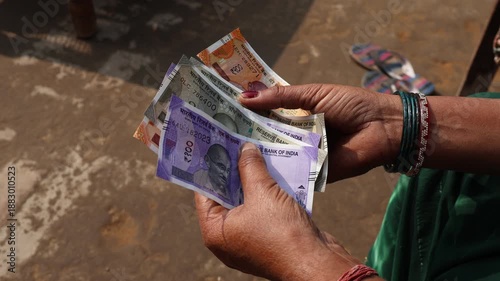 Indian women counting Indian currency notes, Indian rupee 500 notes.