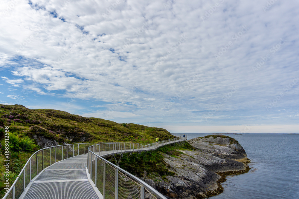 Obraz premium Scenic Elevated Metal Walkway Path at Eldhusøya along Atlantic Ocean Road Norway