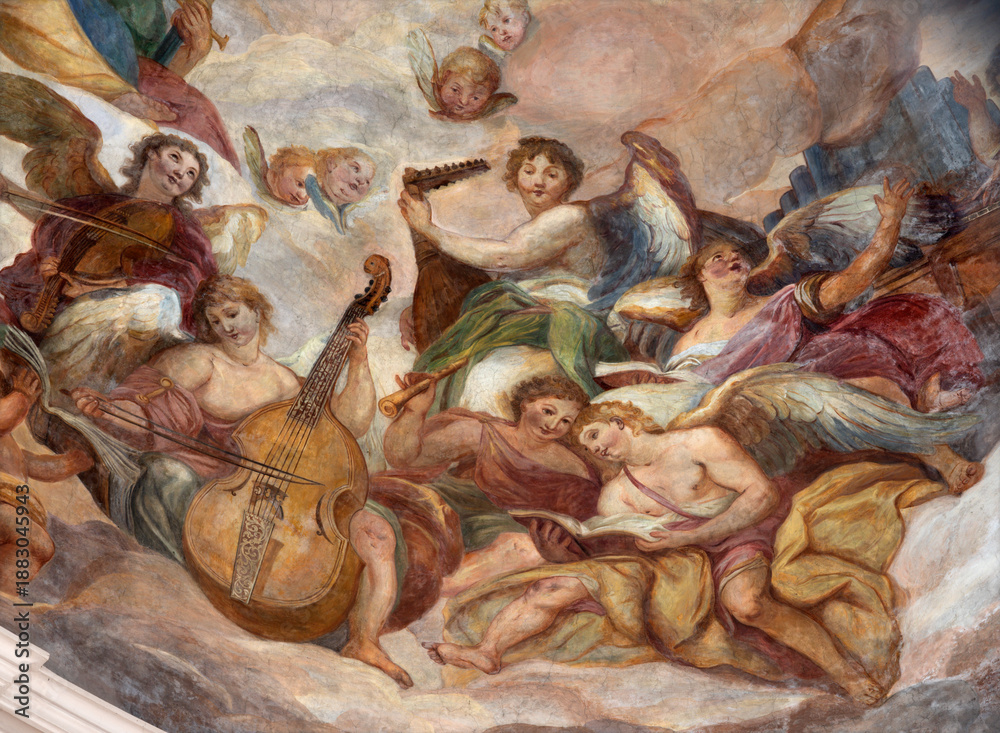Obraz premium SALZBURG, AUSTIRA - SEPTEMBER 7, 2025: The angels with the music instruments in the cupola of church Dreifaltigkeitskirche (Holy Trinity) by Johann Michael Rottmayr (1679 - 1700).