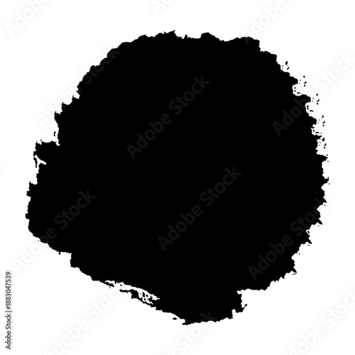 A large black ink smudge on a white background