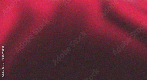 A vibrant abstract background featuring a textured blend of red black and subtle hints of purple hues
