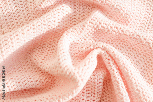 Photos Soft crochet baby blanket arranged in gentle folds highlighting handmade texture