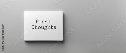 Closing Remarks text on a white notebook, front perspective against a gray backdrop