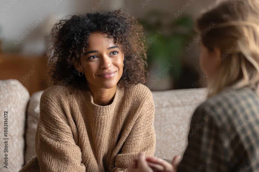 Fototapeta premium Attentive ear: a calm woman listening with empathy during a quiet conversation
