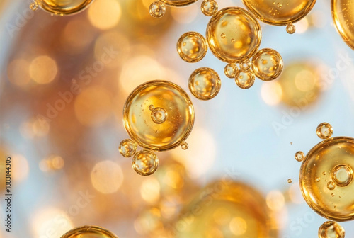 Macro photography of golden yellow oil bubbles floating in water for abstract cosmetic serum background