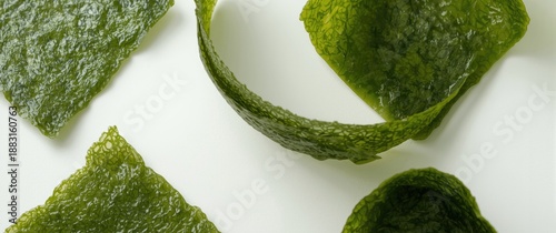 Isolated natural nori sheets against white backdrop