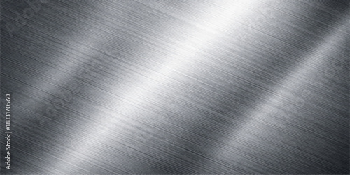 Polished silver brushed metal texture background with a shiny industrial chrome plate surface featuring a grey metallic aluminum material pattern and light reflection on a stainless steel sheet