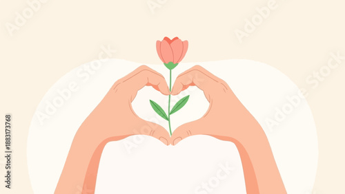 Two hands form a heart shape around a delicate pink flower bud