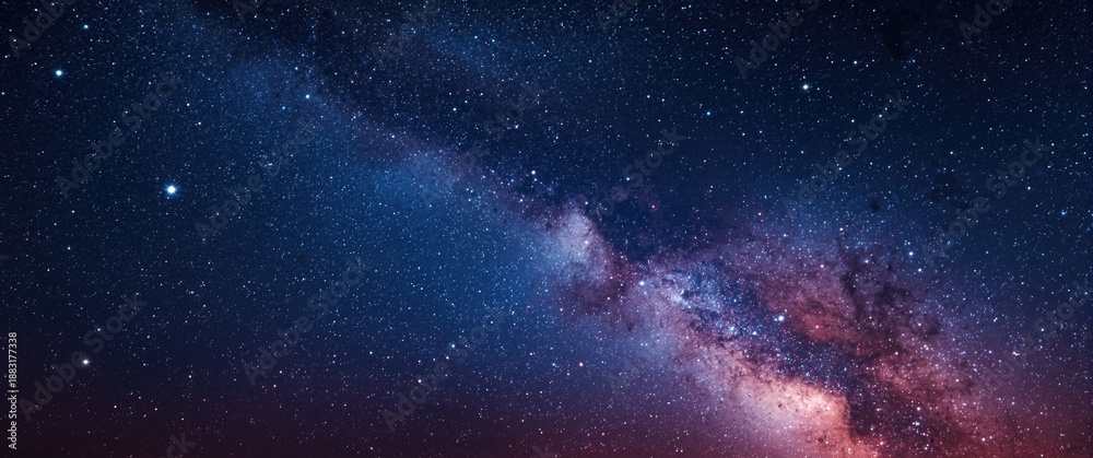 Fototapeta premium Stars flashing in the night sky with a nebula galaxy in the background of blue and purple cosmos