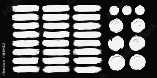 White grunge brush strokes and rough paint textures set on black background. Artistic hand drawn ink smears, scribble marks and messy paint . Abstract creative design elements for banners and posters.