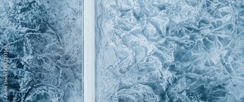 White winter snow-covered road on mountain hill seen from satellite, with ice and glass patterns in Xinjiang winter