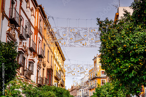Colorful street in Seville with Christmas decorations, Spain.
