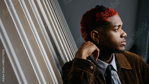 Profile portrait of a black man with thoughtful look