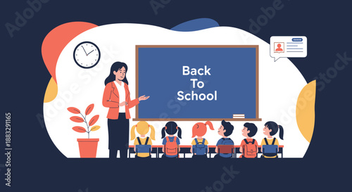 Professional female teacher standing by a blackboard in front of her students during a back to school lesson in a classroom.