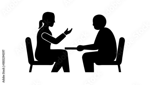 Silhouette of two people sitting and talking, one offering a hand on the shoulder, mental health support and counseling concept