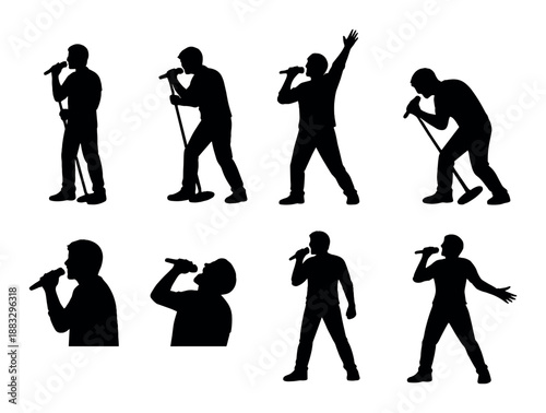 Silhouette of male singer performing with microphone on stage