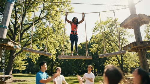Teamwork Triumphs - Woman Conquers Obstacle Course with Friends Support.