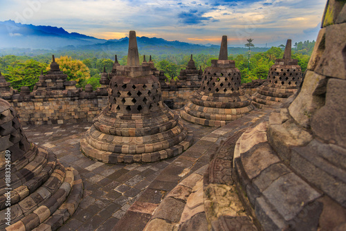 Tableau sur toile Stone Stupas of Borobudur Temple at Dusk, Indonesia