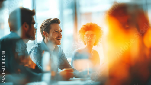 Cinematic lens flare and bokeh frame a candid collaboration within a modern office startup team © mozZz