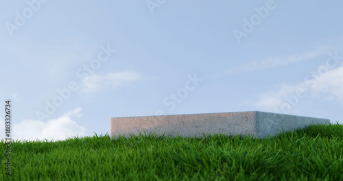 Bild auf Leinwand Minimal Stone Platform on Green Grass Field