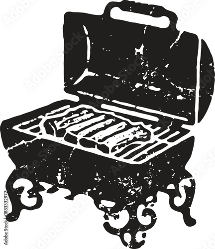 Vintage barbecue grill with ornate legs and open lid showing grilling surface